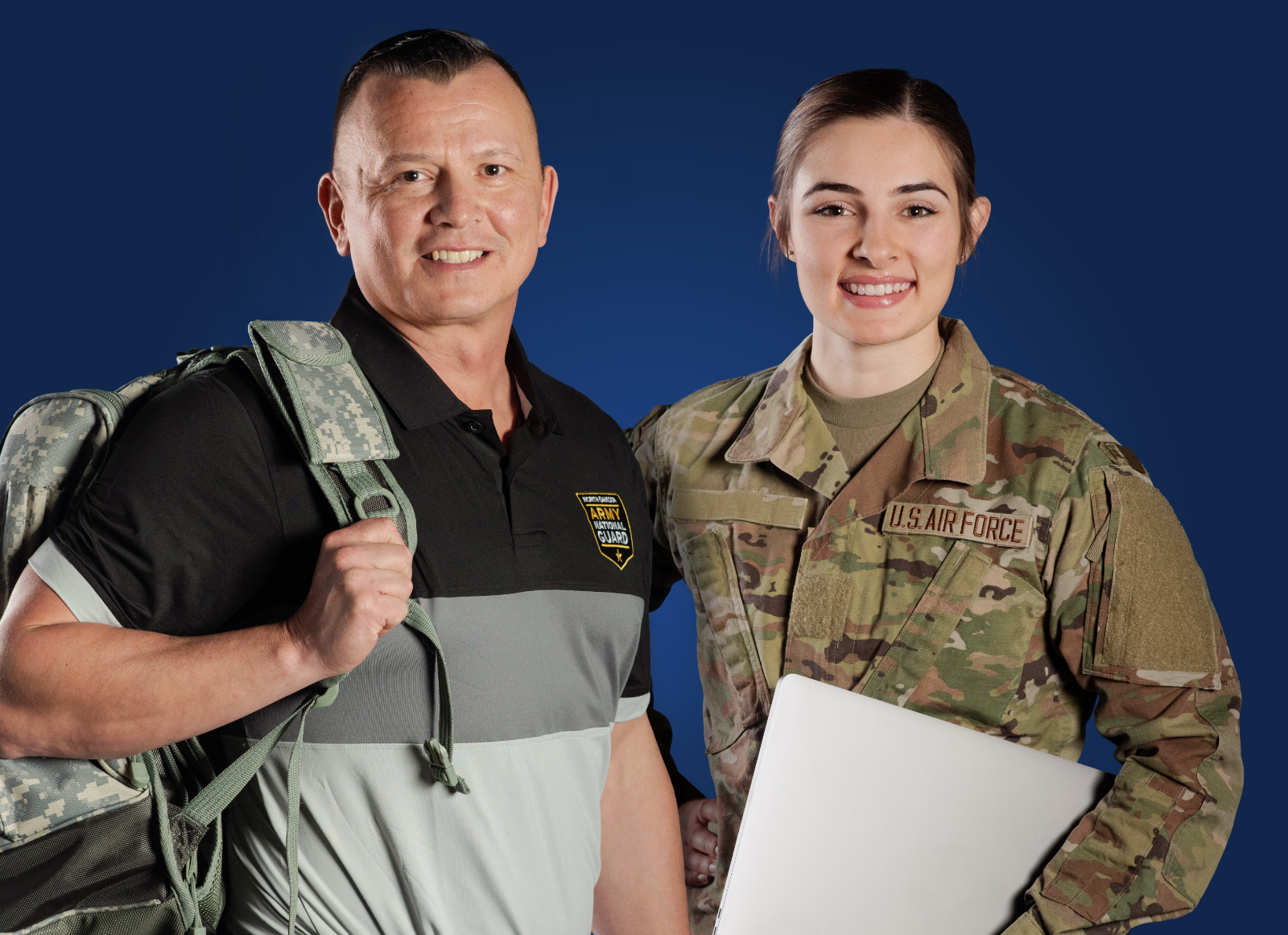 Two service members in casual attire; a man in casual attire and a woman in uniform.